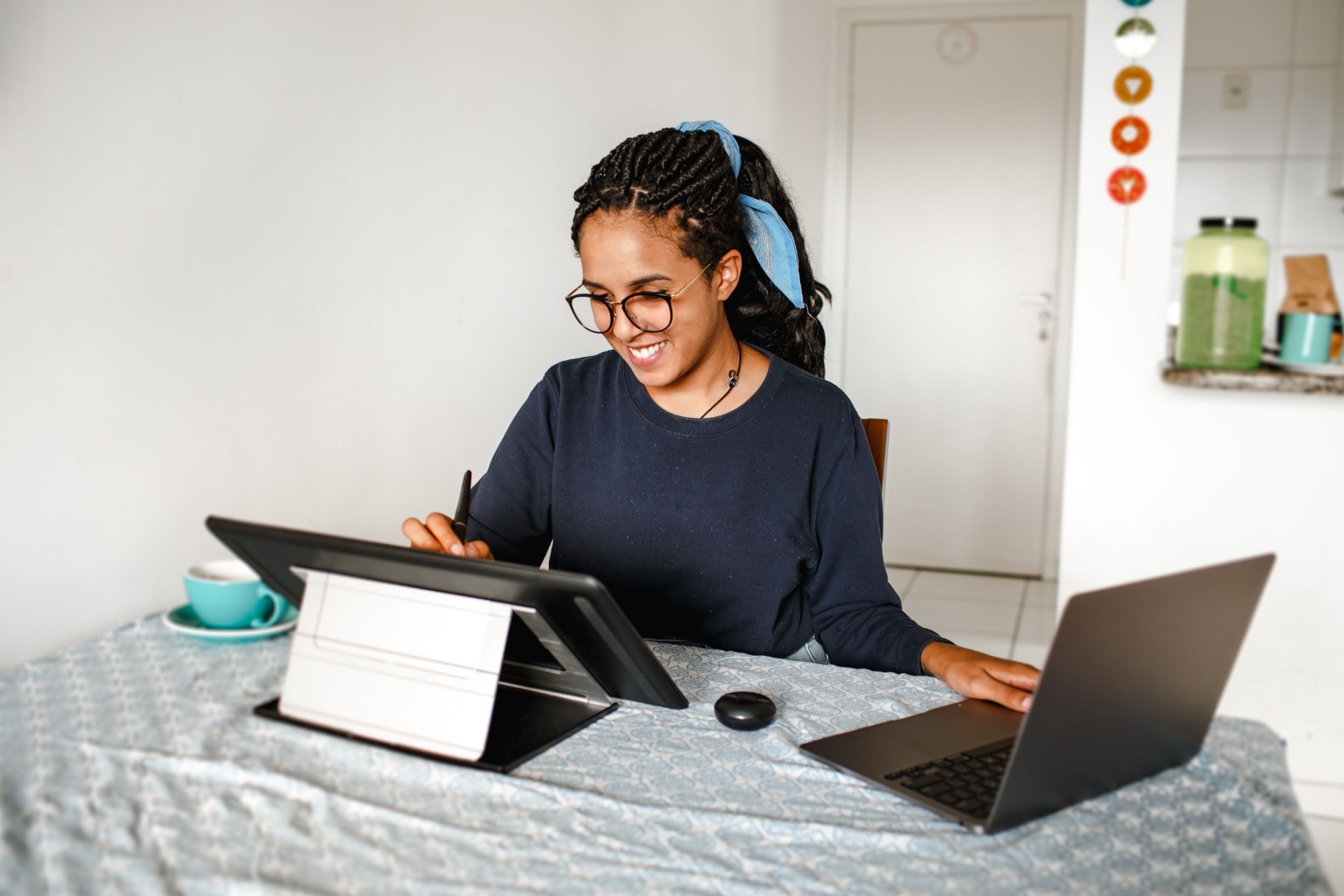 Virtual Tribe member working remotely from her home desk